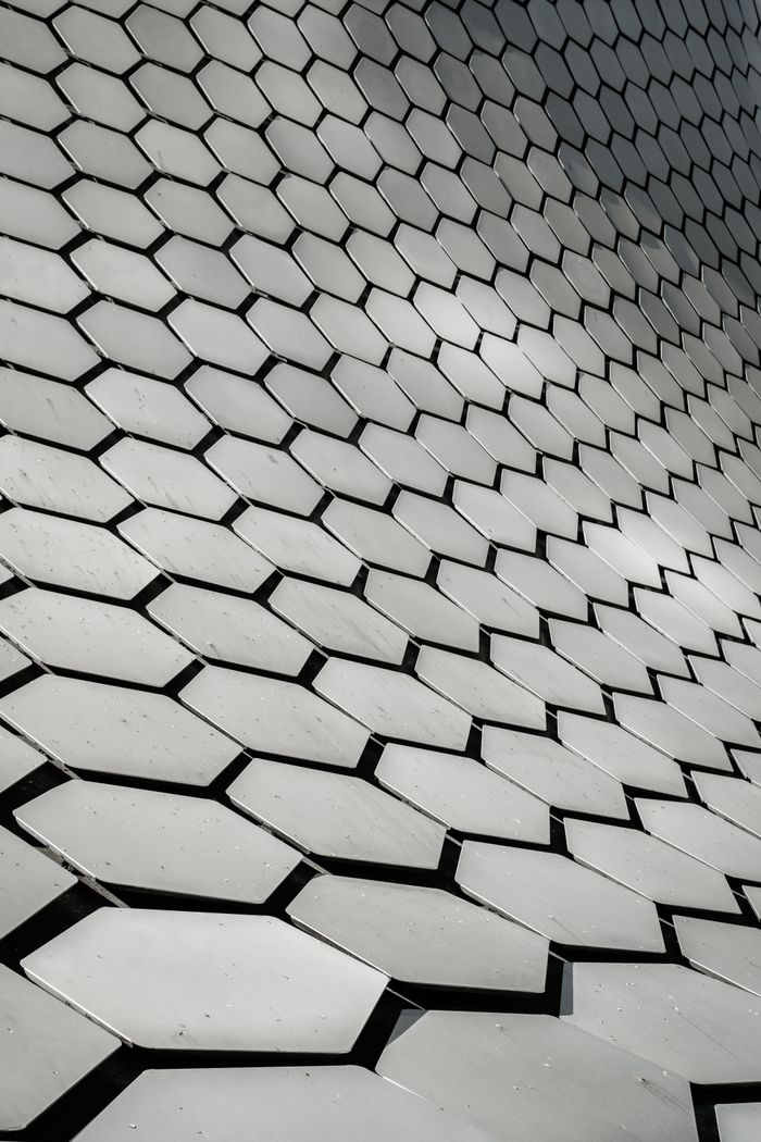 Geometric pattern of Museo Soumaya's hexagonal facade in Mexico City.